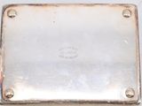 a close up of a metal box with a metal plate on top of it