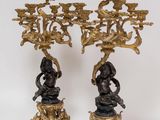 pair of antique bronze candelabs with figures on pedestals