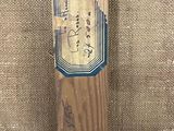 a baseball bat that has a sticker on it