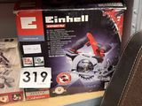 a box of electric tools on a shelf in a store