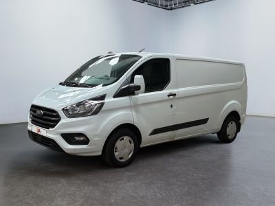the white van is parked in a large room
