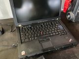 a laptop computer sitting on top of a table