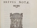 an old book with a picture of a man in a chair on top of it