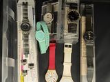 many different watches in the box on the table