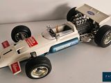 a model of a racing car on a white surface