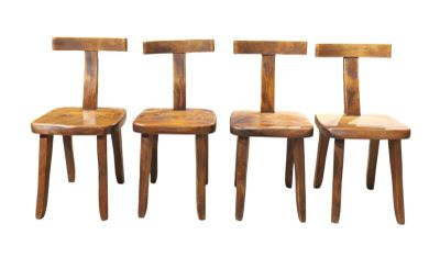 three wooden chairs sitting next to each other on a white surface