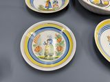 several plates with designs on them are sitting on a table