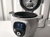 a close up of a small electric fryer sitting on a counter
