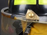 a close up of a fireman ' s helmet with a visor