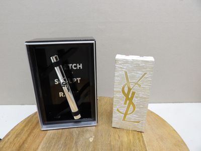 a box of mascara and a box of mascara on a table