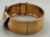 an image of a close up of a bracelet on a white surface