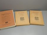 three books sitting on top of a table next to each other