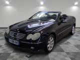 a picture of a black convertible car parked in a garage