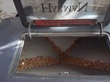 a metal box with seeds in it on a table
