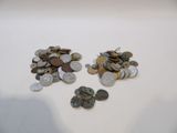 a pile of coins sitting on a table next to each other