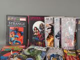 a lot of comic books sitting on a table