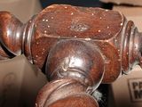 a close up of a wooden bed frame with wood spindles