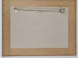 an empty picture frame hanging on a wall in a room