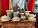 a lot of plates and bowls on a table
