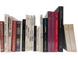 a lot of books that are on a shelf