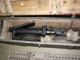 a tool in a wooden box on the floor