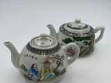 pair of chinese porcelain teapots with hand painted scenes