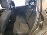 the back seats of a car are empty and the seats are black