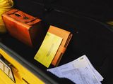 a suitcase and a bag in the trunk of a car
