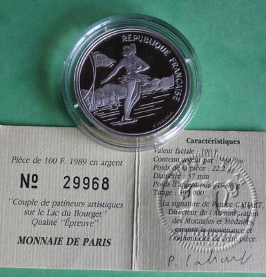the coin is sitting on top of a piece of paper on a table