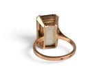 an image of a close up of a ring on a white surface