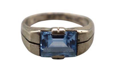 an image of a ring with a blue stone in it