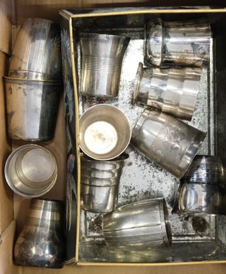a box full of silver cups and pans in it