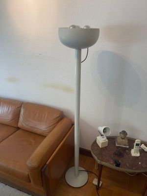 a brown leather couch and a table in a living room