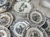 a lot of plates that are sitting on a table