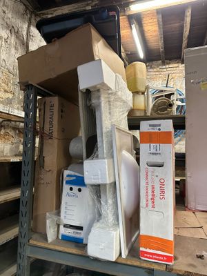 many boxes and boxes on a shelf in a room