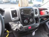 a dashboard of a truck with a radio and other items in it
