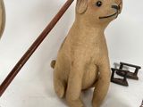 a stuffed dog and a wooden toy on a white background