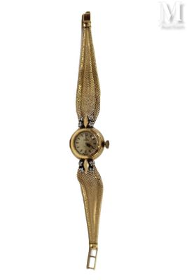 an image of a gold wrist watch with a metal band