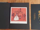 an open book with a picture of a woman in a white dress and a man in a black suit