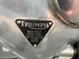 a close up of a motorcycle with a triangle on the front of it
