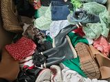 a box full of clothes and shoes that are in it