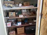 many boxes and boxes on the shelves in the room