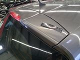 a car that has a sticker on the hood of it
