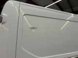 an image of a white truck in a garage