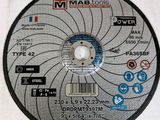 a close up of a metal cutting disc on a white surface