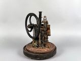 an old model of a steam engine sitting on top of a wooden base