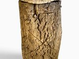 a wooden stool made out of a tree stump