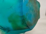 a close up of a toothbrush with a blue liquid inside of it