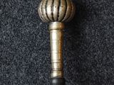 a metal stick that has a ball on it