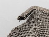 an antique silver mesh purse with a chain link clasp